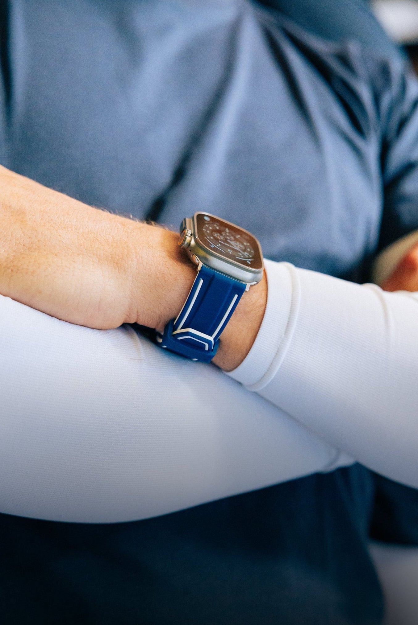 Model wearing blue and white Henley Apple Watch strap