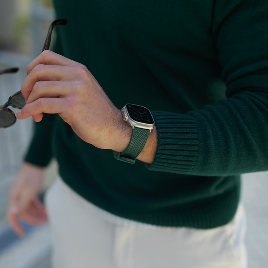 Model wearing dark green Apple Watch strap