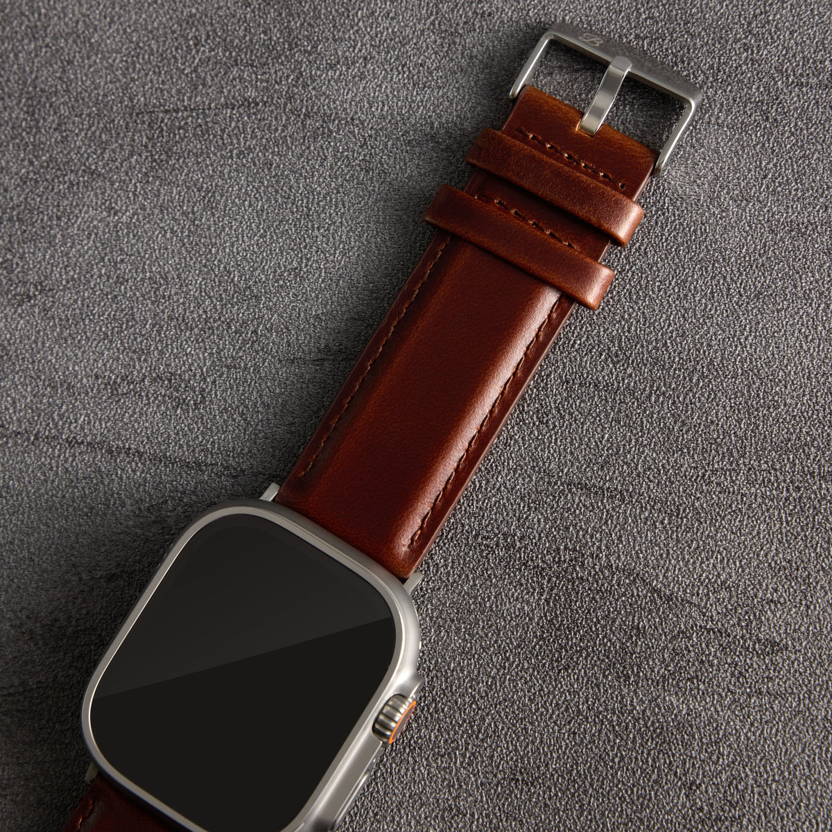 Dark brown Heritage leather Apple Watch strap, angled close-up – The Bridge