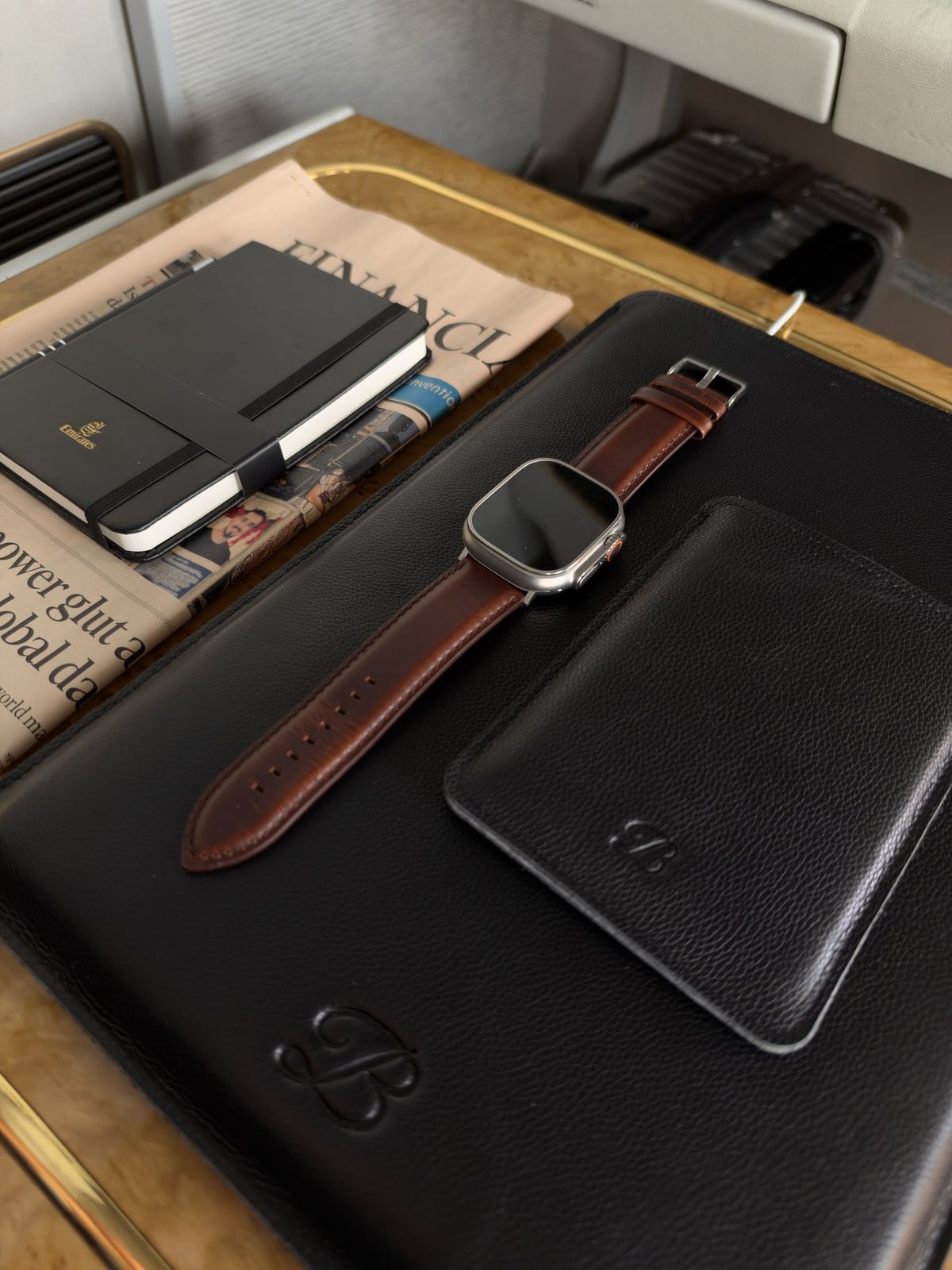 Dark brown Heritage Apple Watch strap tabletop close-up detail – The Bridge