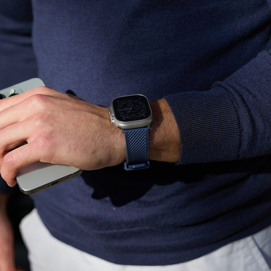 Model wearing dark green Apple Watch strap