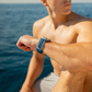 Man on a boat looking out over the water with a watch on his wrist.